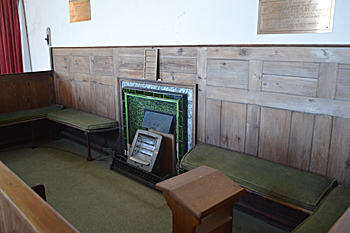 Box pew and fireplace on the south side of the chancel October 2015